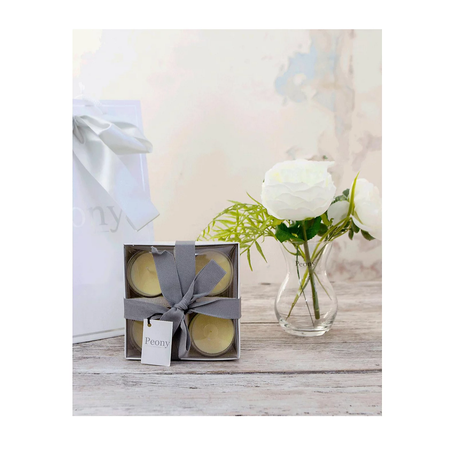 Peony Roses, Ranucula & Foliage in a Dainty Hourglass Vase w/ 4 Candles & Bag